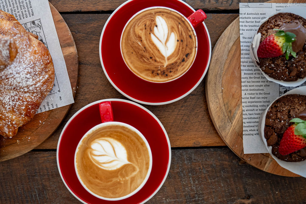 Two flat whites with latte art